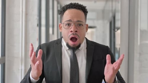 Shocked Business Man Reacts to Bad News