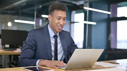 Young Adult Having Online Meeting Using Laptop