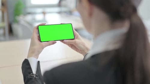 Businesswoman Holding Smartphone with Green Screen