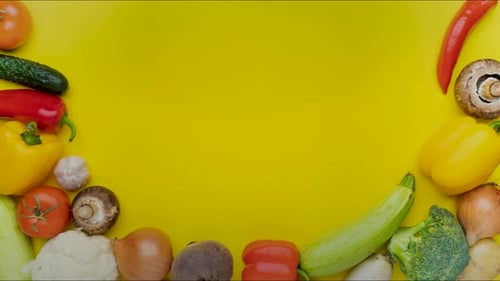 Moving Vegetables on Yellow Background