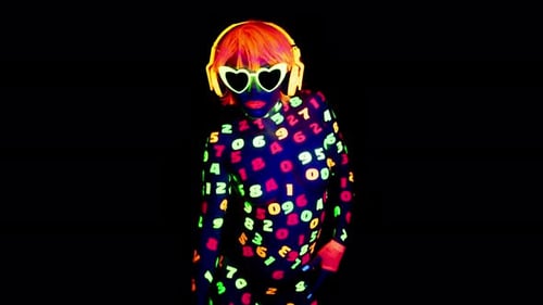 Woman in Glowing Number Bodysuit Poses