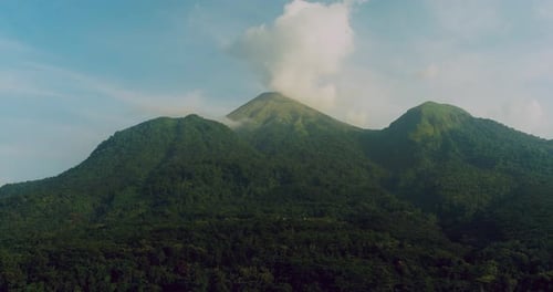 Cinematic Drone Reveal of Sunlit Tropical Mountain Forest Landscape