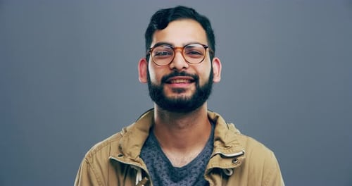 Smiling Young Adult Giving Thumbs Up