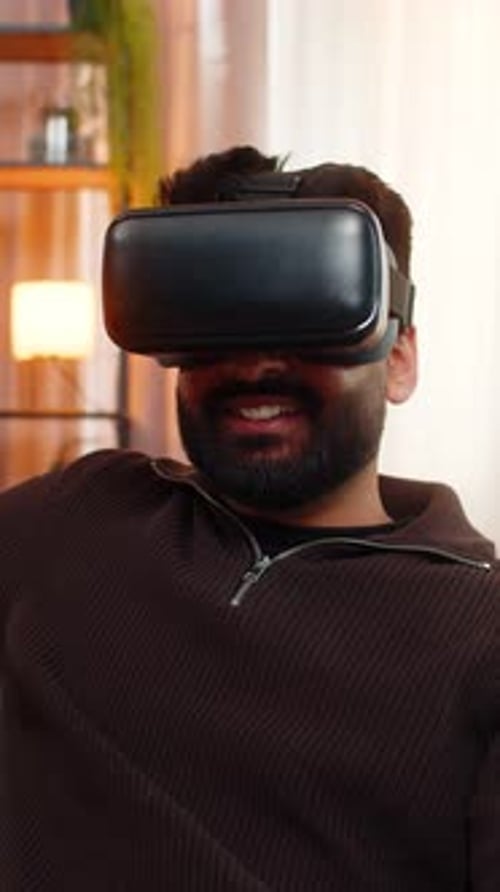 Man with VR Headset Smiling in Living Room