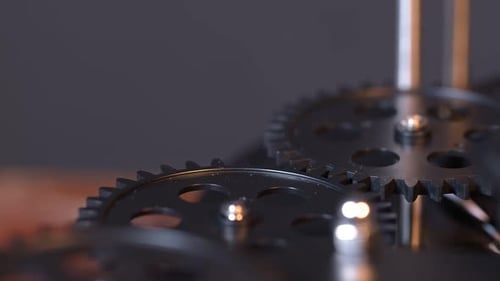 Rotating Black Gears Meshing in Close Up View