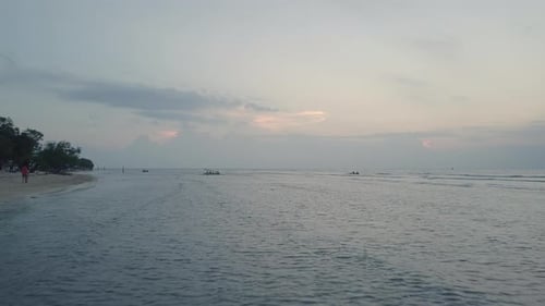 Sunset drone shot of beach coastline on Casa Vintage Beach in Thailand