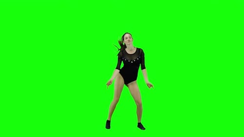 Beautiful female dancer wearing leotard in front of a green screen