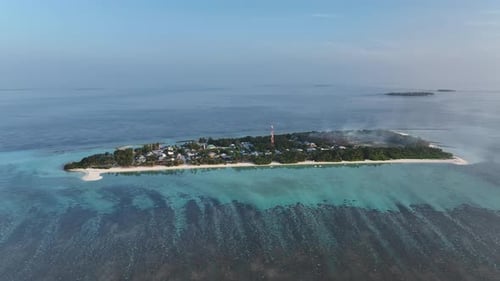 Aerial view of Naavaidhoo island with tower, Maldives.