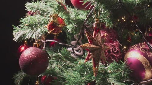Close-Up of Christmas Tree with Red and Gold Ornaments