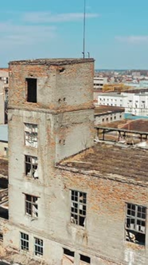 Industrial buildings in abandoned factory. Old ruined abandoned concrete factory exterior