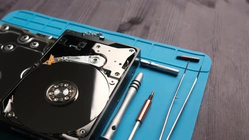 Open Hard Data Disk Drive on a Servicema's Table