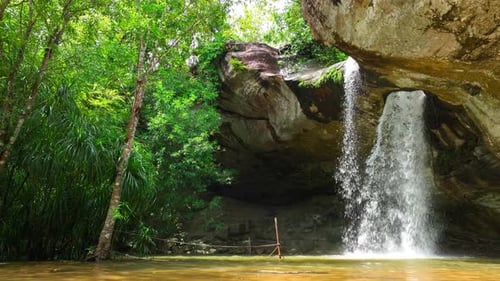 Gorgeous waterfall emerges from mysterious hole.