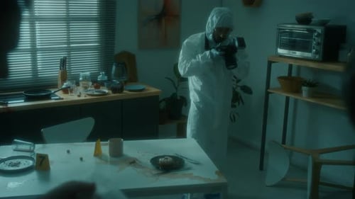 Crime Scene Investigator Photographs Messy Kitchen