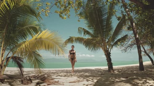 Woman Walking on a Tropical Beach in Thailand