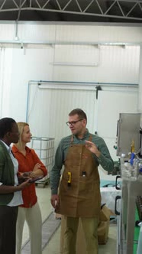 Group of Colleagues Talking at a Factory