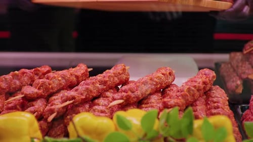 Close up turkish kebab lamb meat on skewers in supermarket.