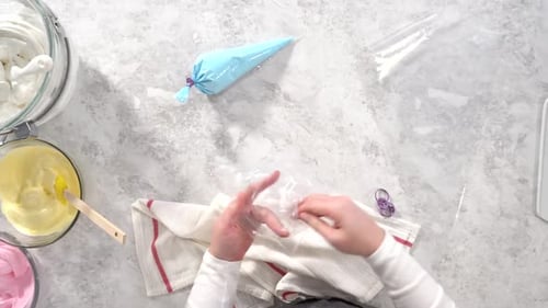 Flat Lay Step By Step Transfering Meringue Mix Into Piping Bags with Metal Tips to Bake Unicorn