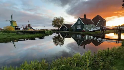 Picturesque Dutch Countryside with Windmills at Sunset