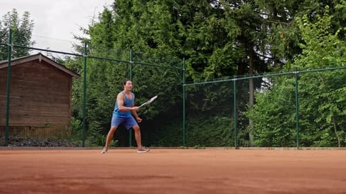 A Dynamic Tennis Player Showcases Impressive Skills on a Clay Court Capturing the Essence of