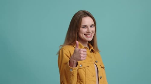 Woman Gives Thumbs Up with a Smile