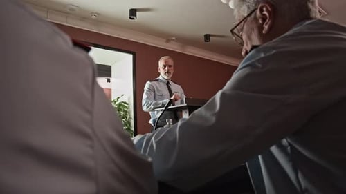 Man Giving Speech at Corporate Conference