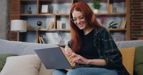 Virtual home office, distance job. Freelancer Smiling woman remote working online using laptop