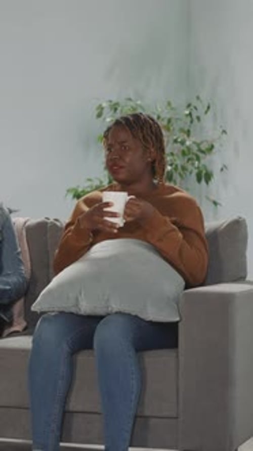 Indian and African American Women Friends Change Channels