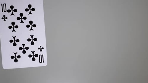 Playing Cards Demonstrated on Gray Surface