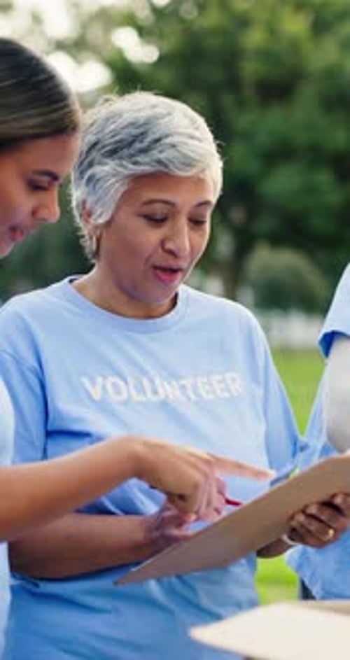 Woman, volunteer and talk with clipboard at park for donation, point and writing with social