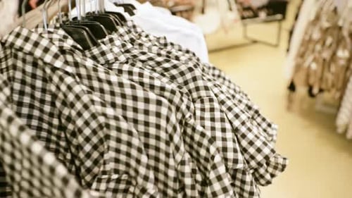 Many Shirts On Hanger In Store Of Shopping Center