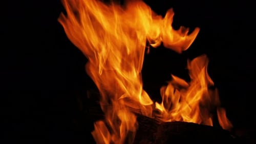 Bonfire flames burning brightly with texture detail in high definition 4k