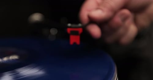 Turntable Needle on a Spinning Blue Record