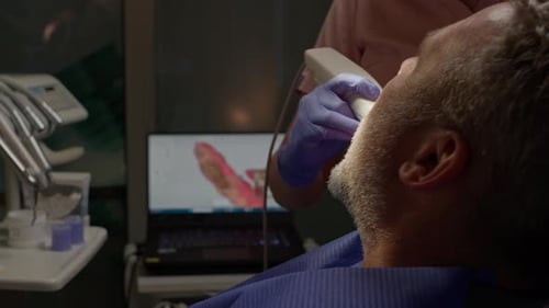 Dentist Using 3D Dental Intraoral Scanner For Scanning Patient's. Teeth for Healthcare Concept