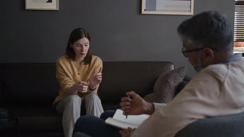 Woman on Couch Speaking in Individual Therapy Session