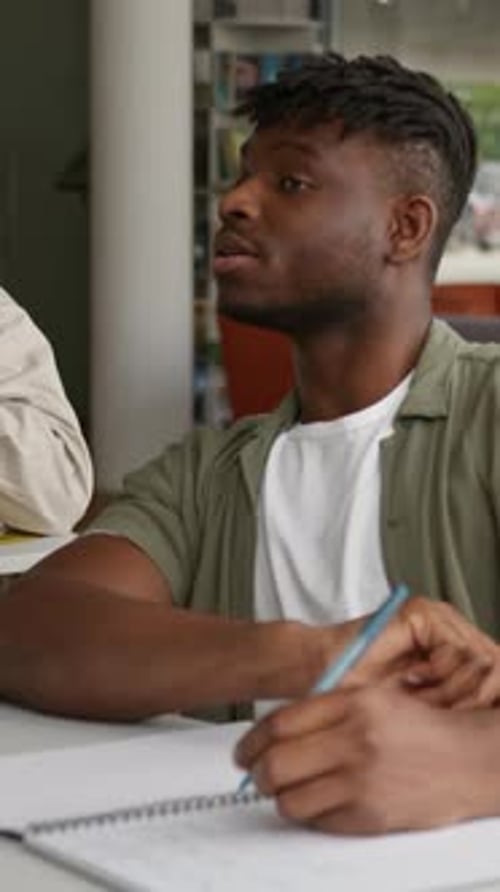 Three Diversity Students Classmates in Class Academy Studying Caucasian Man Asking Help African