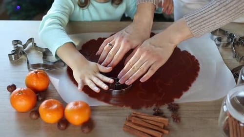Child and Adult Making Holiday Cookies
