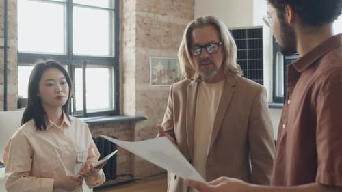 Happy Diverse Engineers Approving Renewable Energy Project