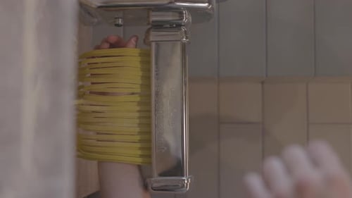Italian Pasta Being Made on the Machine for Cutting Dough Fresh Handmade Pasta Machine Rolling Dough