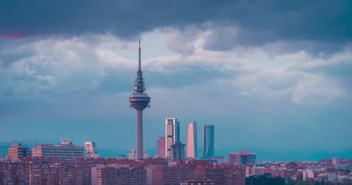 Madrid skyline day to night timelapse during stormy sunset five towers business area and piruli