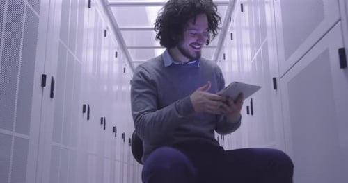IT Engineer Using Tablet in Server Room