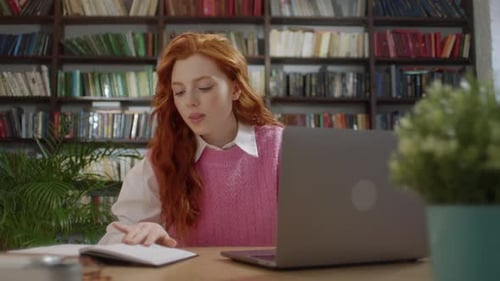 Woman Studies With Laptop at Desk