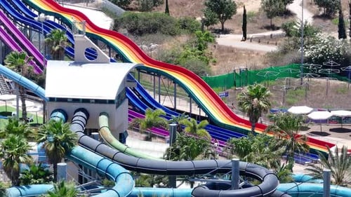 Aerial view of people sliding down a water slide at a water park