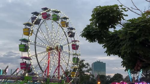 Amusement Park Roller Coaster and Ferris Wheel at Sunset in Dartmouth Canada