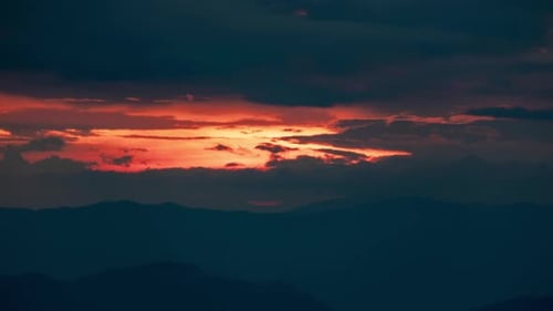 Time lapse of the beautiful sunset scenery on the top of the mountain.