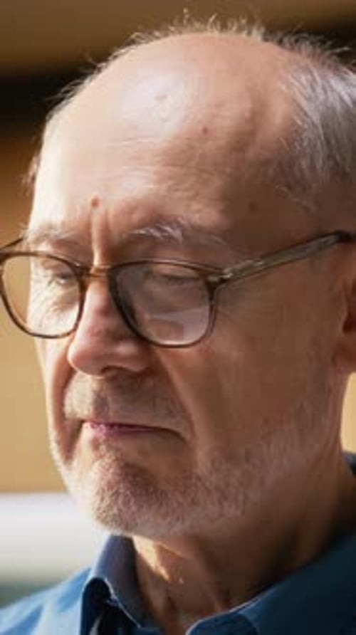 Senior Man Close Up Smiling in Home