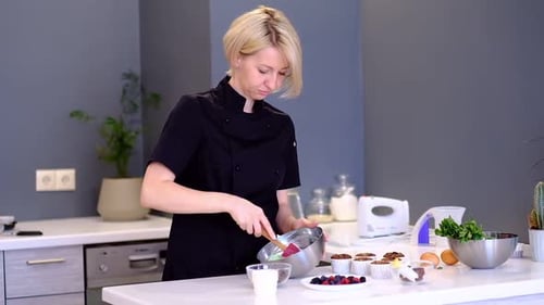 Woman Mixes Batter in Kitchen for Baking