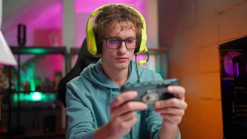 Man Plays Video Games at Home