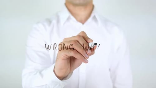 Wrong Way Man Writing on Glass