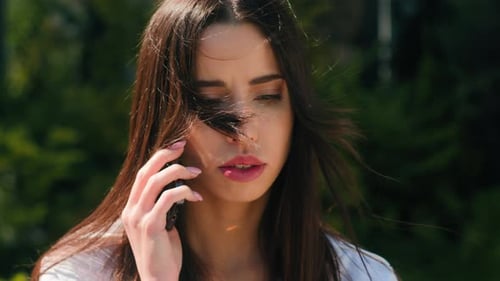 Woman Using Smartphone for Communication in Urban Area