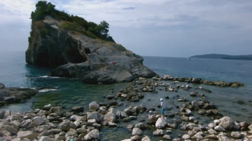Rock and Stone Coast with Walking Tourists
